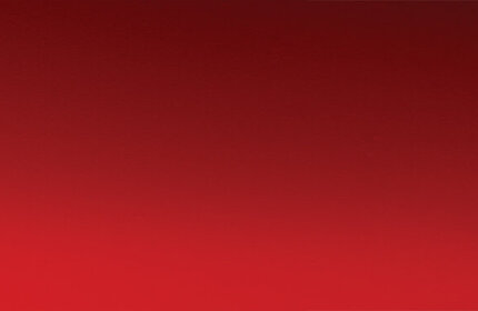 A luxurious jar of cream and an elegant compact on a gradient red background, conveying a sense of richness and elegance.