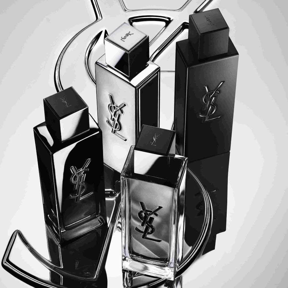 Vier YSL-parfumflacons in zwart en zilver