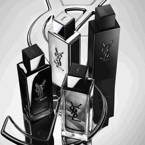 Vier YSL-parfumflacons in zwart en zilver