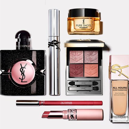 Flat-lay van YSL beautyproducten waaronder parfum, verzorging en make-up.