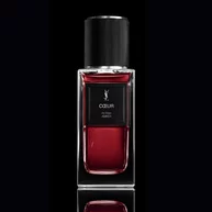 COEUR Eau de Parfum robijnrode fles met zwarte dop op een reflecterende YSL-achtergrond.